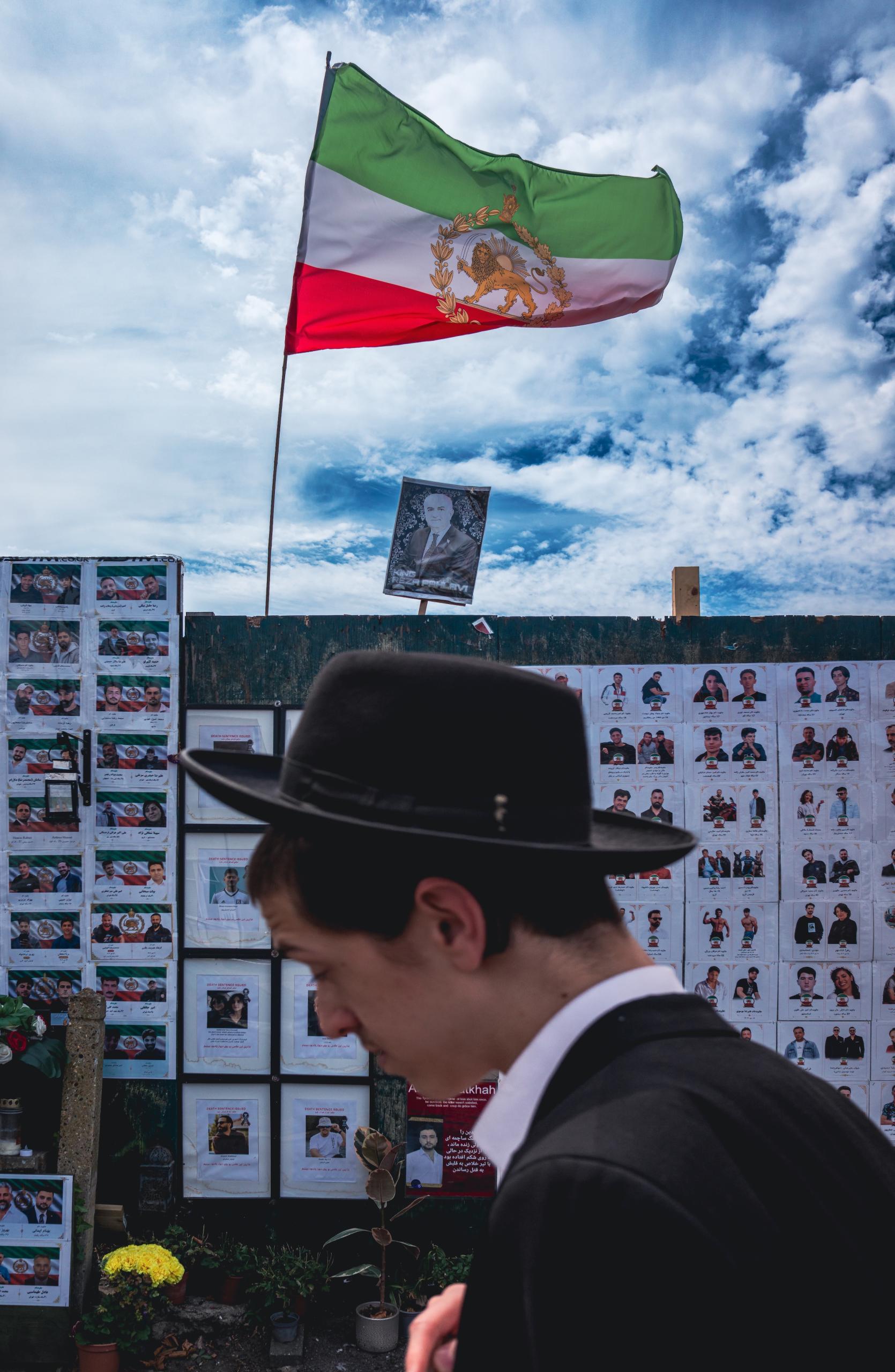 Haredi and Iranian flag. Golders Green memorial wall, London.